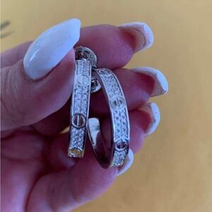White gold plated pave medium hoop earrings. New.